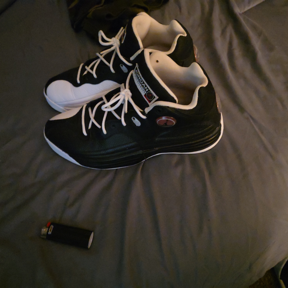 JordanJumpman Sneaker Line Men's Black and White Athletic Shoes.